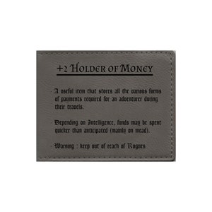 May include: A gray leather pouch with the text "+2 Holder of Money" printed on the front. The pouch is described as a useful item for storing payments required for an adventurer during their travels. It also states that depending on intelligence, funds may be spent quicker than anticipated, mainly on mead. A warning is included to keep the pouch out of reach of rogues.