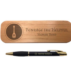May include: A wooden nameplate with the text "Fenrage the Helpful Human Bard" and a circular design featuring a lute. A black pen with gold accents and the text "Roll for Initiative" is also pictured.