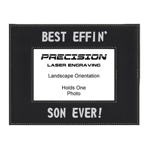 May include: Black leather picture frame with white stitching and the text "Best Effin' Son Ever!"  The frame is for a landscape orientation photo and says "Precision Laser Engraving" on the front.