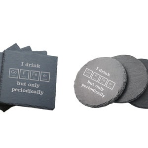 May include: Set of four gray slate coasters with the text "I drink Co F Fe e- but only periodically" in white. The coasters are square and have rounded corners.