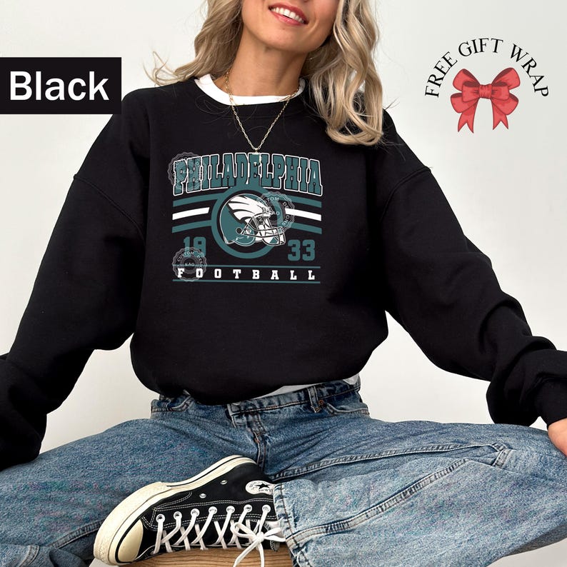 Philadelphia football sweatshirt designed with a classic unisex crewneck fit, ideal for Sunday football games, tailgating, or cozy fall weekends. This stylish and comfortable sweater is perfect for men, women, and kids who love showing Philadelphia team pride. Great sports apparel for football season, and a thoughtful gift idea for fans of all ages looking for quality game day clothing.