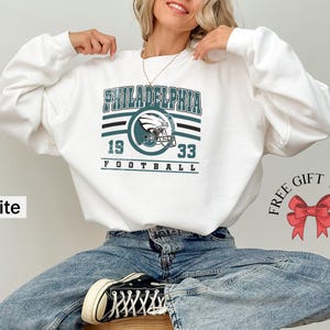 Philadelphia football sweatshirt designed with a classic unisex crewneck fit, ideal for Sunday football games, tailgating, or cozy fall weekends. This stylish and comfortable sweater is perfect for men, women, and kids who love showing Philadelphia team pride. Great sports apparel for football season, and a thoughtful gift idea for fans of all ages looking for quality game day clothing.