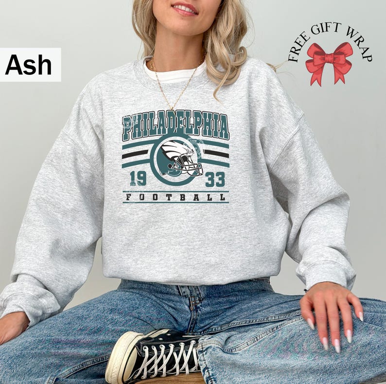 Philadelphia football sweatshirt designed with a classic unisex crewneck fit, ideal for Sunday football games, tailgating, or cozy fall weekends. This stylish and comfortable sweater is perfect for men, women, and kids who love showing Philadelphia team pride. Great sports apparel for football season, and a thoughtful gift idea for fans of all ages looking for quality game day clothing.