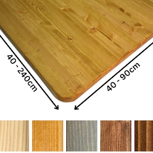May include: A wooden tabletop with rounded corners, in a natural wood tone. The dimensions are indicated as 40-240cm long and 40-90cm wide. Several wood stain color samples are shown below the table.