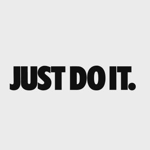 May include: Black text on a white background reads "JUST DO IT." The text is in a bold, sans-serif font. The period at the end of the sentence is a solid black circle. The background is a solid, light gray color.