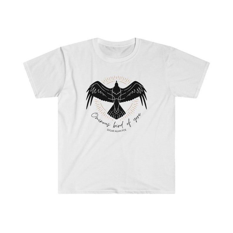 May include: White t-shirt featuring a black silhouette of a raven with the text "Once upon a midnight dreary" and "Edgar Allan Poe" printed on the front.