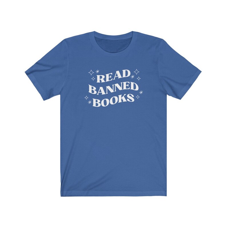 May include: A royal blue t-shirt with the text "READ BANNED BOOKS" in white with stars around the text.