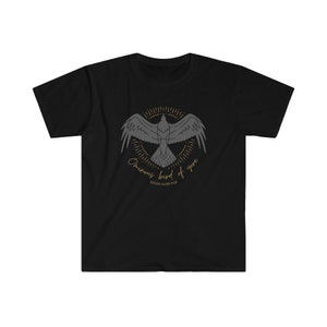 May include: Black t-shirt featuring a graphic of a raven in flight with the text "Once upon a midnight dreary" and "Edgar Allan Poe" underneath.