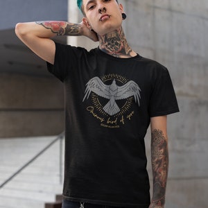 May include: A black t-shirt featuring a graphic of a bird in flight with the text "Ominous bird of yore" and "Edgar Allan Poe" underneath.
