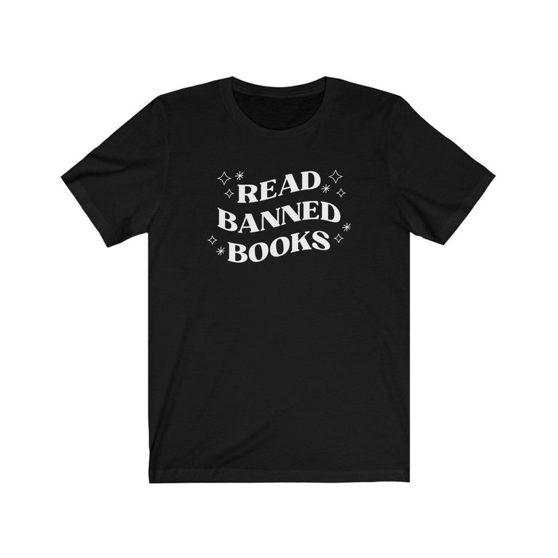 May include: Black t-shirt with white text that reads "READ BANNED BOOKS" surrounded by white stars.