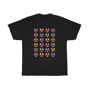 May include: Black t-shirt with a pattern of colorful clown faces. Each face has a red nose, a red mouth, and two eyes in different colors.