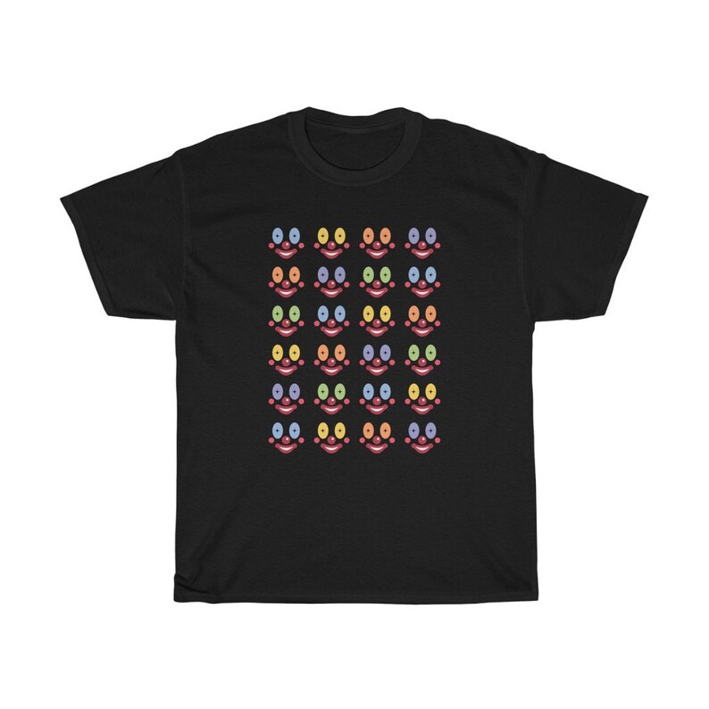May include: Black t-shirt with a pattern of colorful clown faces. Each face has a red nose, a red mouth, and two eyes in different colors.