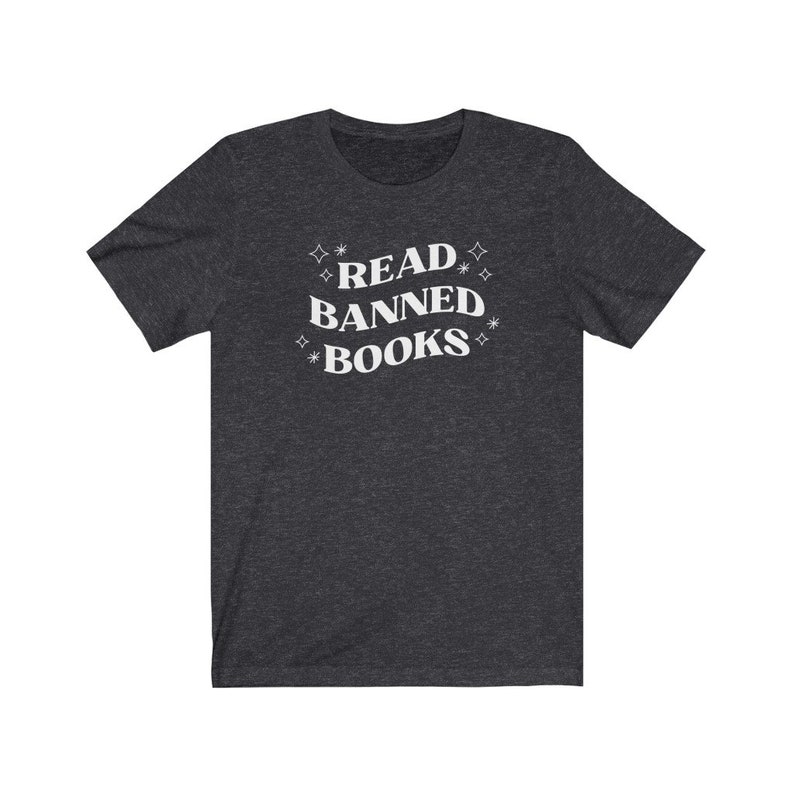 May include: A dark heather grey t-shirt with the text "READ BANNED BOOKS" in white lettering with stars around the text.