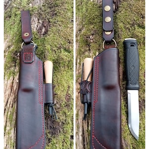 May include: A brown leather sheath with red stitching for a knife and fire starter. The sheath has a belt loop and a snap closure. The knife is a black-handled fixed blade with a silver blade. The fire starter is a small wooden stick with a metal tip.