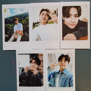 May include: Five Polaroid photos of a young man. The photos show the man in different poses and locations. The photos are all in a white frame.
