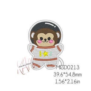May include: Embroidered design of a brown monkey wearing a white astronaut suit with a yellow star on the chest. The design is 1.56 inches by 2.16 inches.