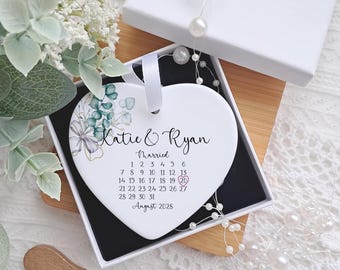 Personalised ceramic heart wedding keepsake with custom names and date for a modern bride and groom gift.