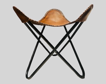 Taburete de mariposa de cuero vintage, reposapiés, taburete plegable, cómodo taburete de habitación, funda de cuero marrón con marco negro plegable.