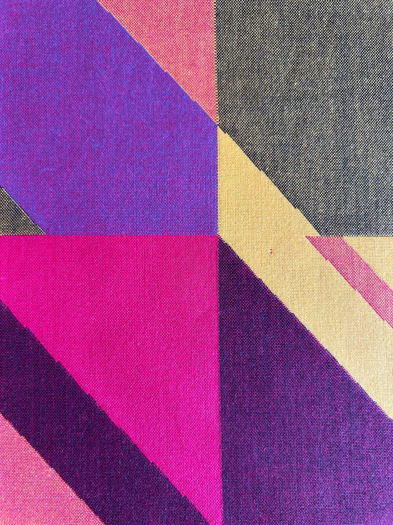 May include: Abstract textile pattern featuring geometric shapes in vibrant colors. The design includes sections of deep purple, hot pink, light pink, beige, and dark gray, creating a bold and modern aesthetic. The fabric has a textured appearance.