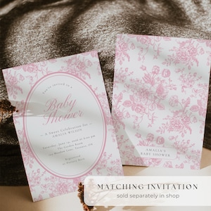 May include: Two baby shower invitations with a pink floral pattern on a white background. The invitation on the left has the text "Baby Shower" and event details. The invitation on the right has the text "Amalia's Baby Shower".