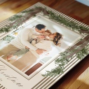 Elegant neutral striped holiday photo card template with greenery details and multiple family pictures, perfect for sending warm Christmas wishes to friends and family