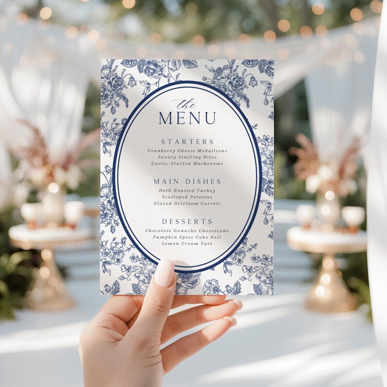 May include: A menu card with a blue floral design and the text "The Menu." The menu lists starters, main dishes, and desserts. The card is held in front of a blurred background.