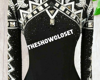 May include: Black and white show shirt with a geometric design and rhinestones. The shirt has a high collar and long sleeves. The text "THESHOWCLOSET" is printed on the front of the shirt.
