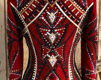 May include: A red, black and gold show shirt with a geometric pattern and rhinestones.