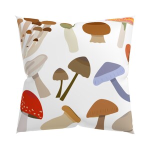 May include: A white pillow with a colorful mushroom pattern. The mushrooms are in various shapes and sizes, including red, brown, white, and blue.