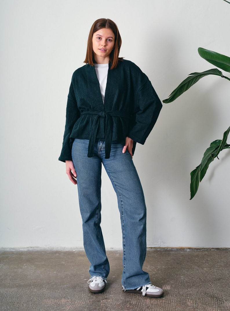 Belted Kimono Cardigan, a  versatile addition to your wardrobe. This open-front cardigan features a lightweight knitted design, perfect for a stylish and comfortable look. The oversized cotton jumper offering a fashionable and eco-friendly option.