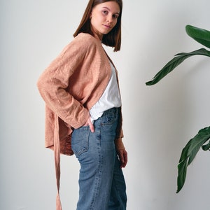 Belted Kimono Cardigan, a  versatile addition to your wardrobe. This open-front cardigan features a lightweight knitted design, perfect for a stylish and comfortable look. The oversized cotton jumper offering a fashionable and eco-friendly option.