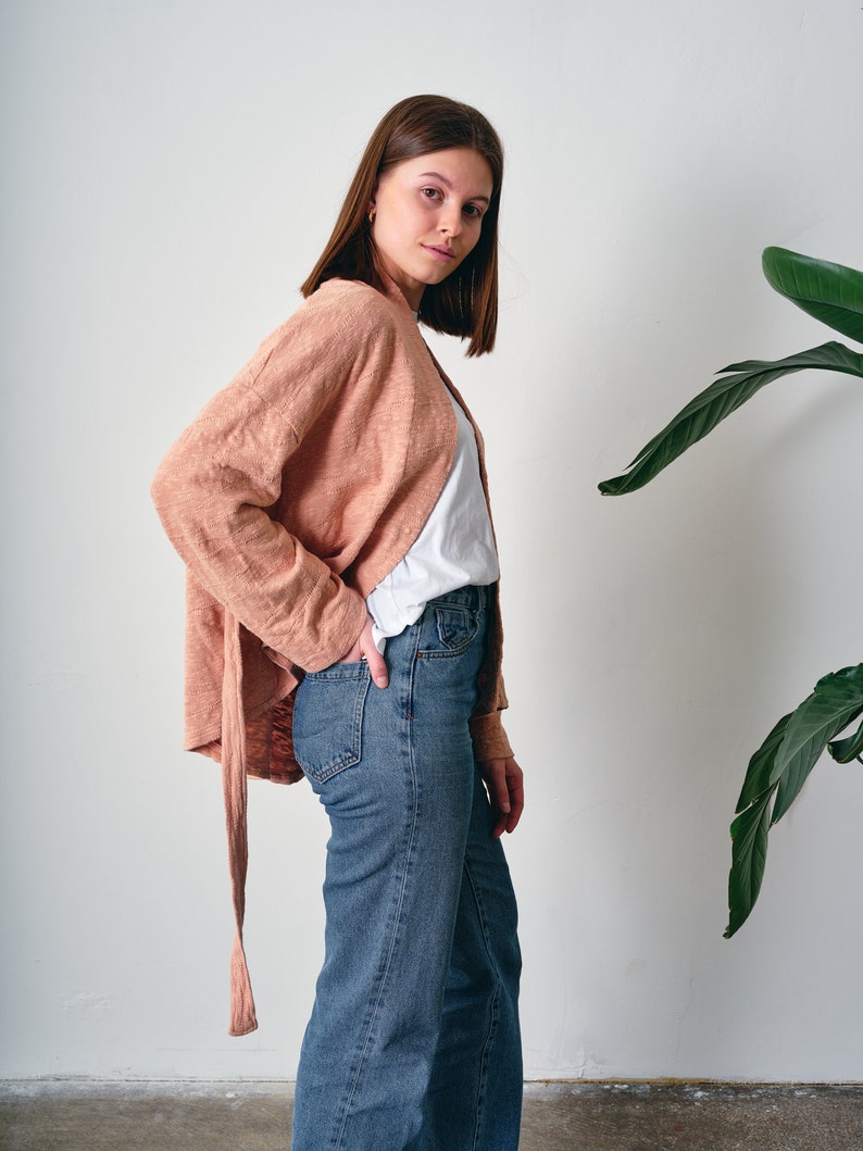 Belted Kimono Cardigan, a  versatile addition to your wardrobe. This open-front cardigan features a lightweight knitted design, perfect for a stylish and comfortable look. The oversized cotton jumper offering a fashionable and eco-friendly option.