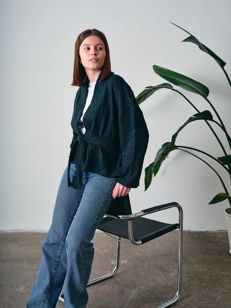 Belted Kimono Cardigan, a  versatile addition to your wardrobe. This open-front cardigan features a lightweight knitted design, perfect for a stylish and comfortable look. The oversized cotton jumper offering a fashionable and eco-friendly option.