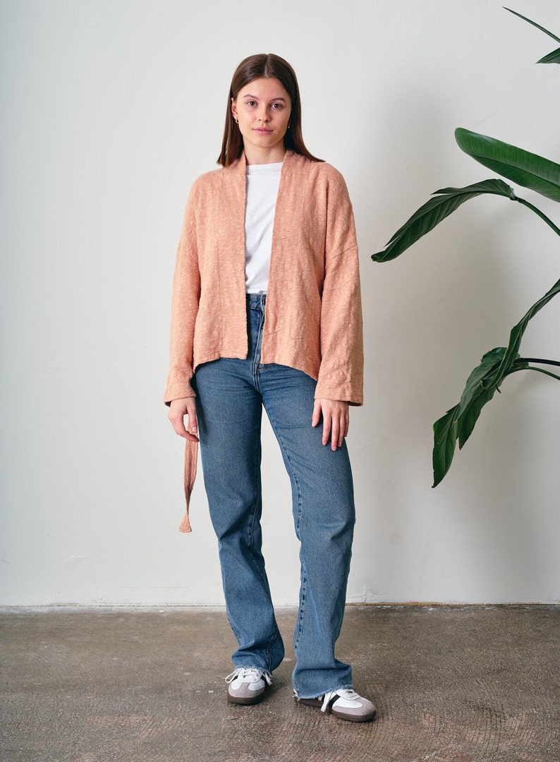 Belted Kimono Cardigan, a  versatile addition to your wardrobe. This open-front cardigan features a lightweight knitted design, perfect for a stylish and comfortable look. The oversized cotton jumper offering a fashionable and eco-friendly option.