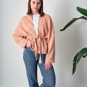 Belted Kimono Cardigan, a  versatile addition to your wardrobe. This open-front cardigan features a lightweight knitted design, perfect for a stylish and comfortable look. The oversized cotton jumper offering a fashionable and eco-friendly option.