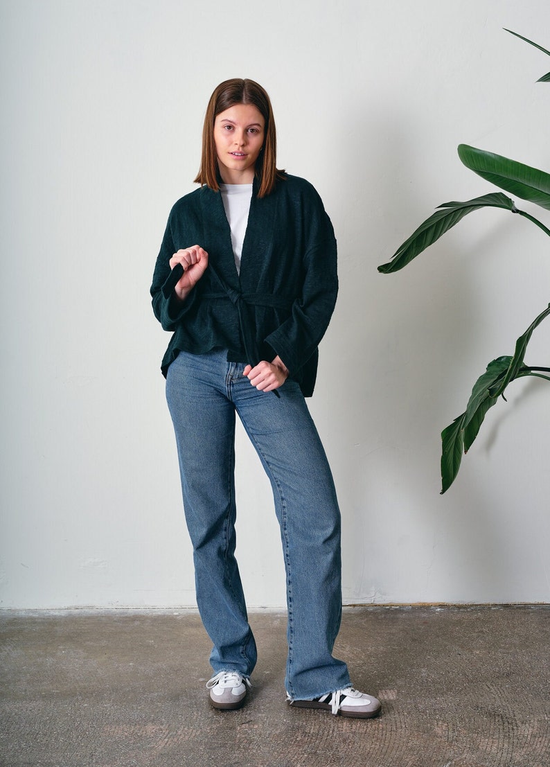 Belted Kimono Cardigan, a  versatile addition to your wardrobe. This open-front cardigan features a lightweight knitted design, perfect for a stylish and comfortable look. The oversized cotton jumper offering a fashionable and eco-friendly option.