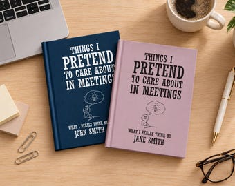 May include: Two hardcover books with the title THINGS I PRETEND TO CARE ABOUT IN MEETINGS. The dark blue book is authored by John Smith, and the light pink book is authored by Jane Smith. Both feature a stick figure illustration with a lightbulb.
