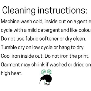 May include: Cleaning instructions for a garment: Machine wash cold, inside out on a gentle cycle with a mild detergent and like colors. Do not use fabric softener or dry clean. Tumble dry on low cycle or hang to dry. Cool iron inside out. Do not iron the print. Garment may shrink if washed or dried on high heat.