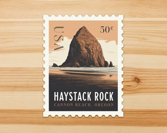 May include: A vintage-style US postage stamp featuring Haystack Rock, a large sea stack located on Cannon Beach, Oregon. The stamp is white with a red, orange, and brown illustration of the rock formation and a blue ocean. The stamp also features the text "USA", "50¢", "HAYSTACK ROCK", and "CANNON BEACH. OREGON."