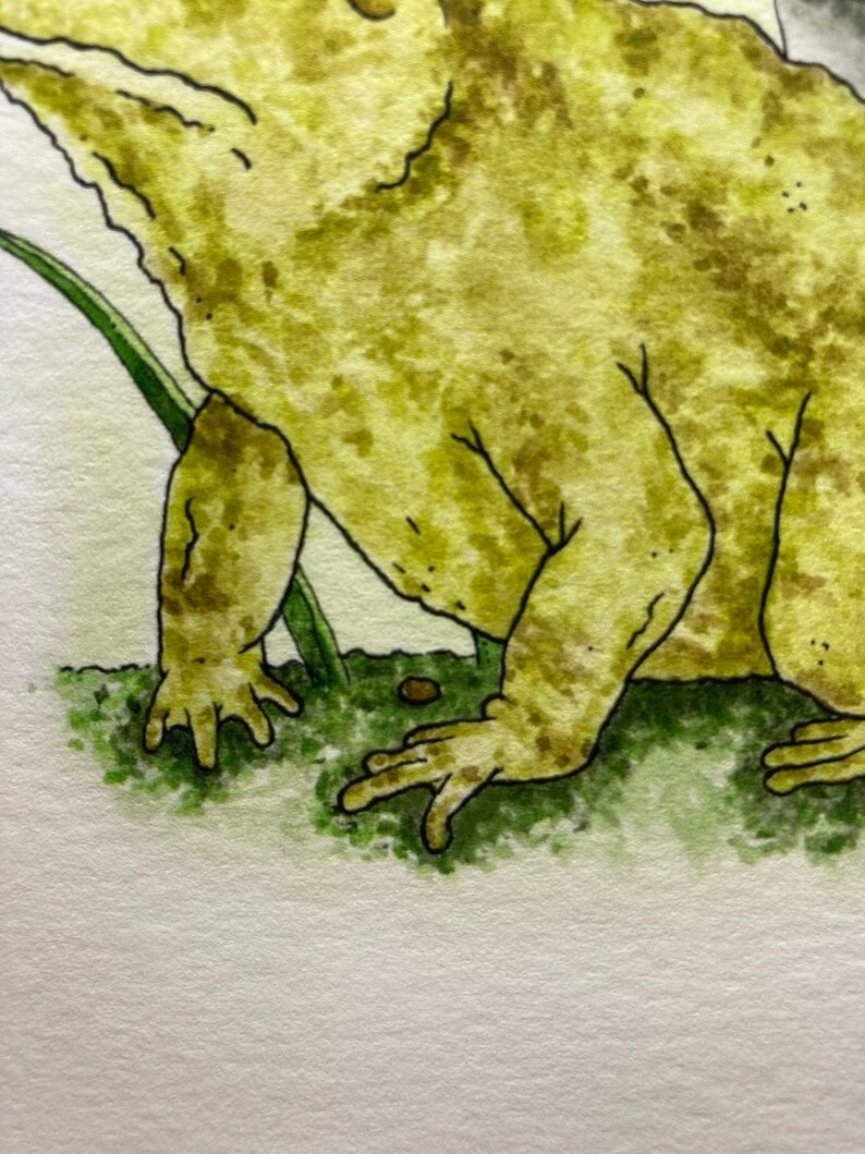 May include: A watercolor painting of a green frog with brown spots, sitting on green grass. The frog is facing the right side of the image.