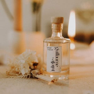 Bottle of floral room fragrance for wedding baptism