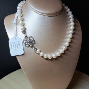 9.5-10mm genuine pearls on Rhinestone Flower clasp