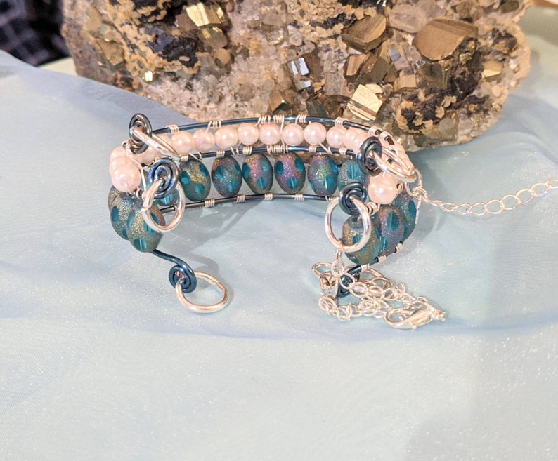 wire wrap beaded bangle bracelet Blue bangle With safety chains. wire wrap bangle