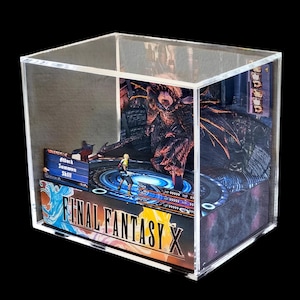 May include: A Final Fantasy X diorama encased in a clear acrylic box. The scene depicts a battle with a character in the foreground and a large monster in the background. The game's logo is visible on the front.