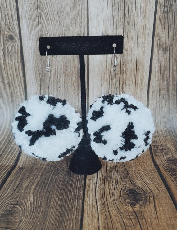 Cow pom pom earrings deals