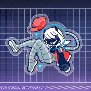 May include: A black and white illustration of a character wearing a red jacket and a space helmet with a blue visor. The character has white hair and horns. The character is floating in space with a red hat and a blue and white space suit. The illustration is on a grid background with the text "DDK Deemo Keychain" and "Kakigori galaxy astronaut ver."