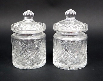 Pair of crystal lid vases with diamond motif