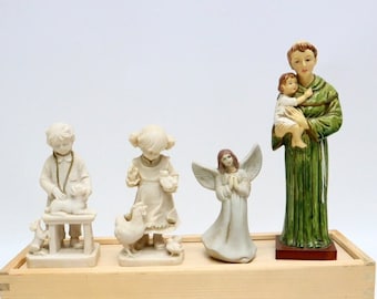 Collection of 4 porcelain sculpture figurines.