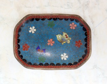 Handmade enamelled dish with floral images.