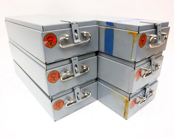 Six pieces of vintage bank vault drawers with lockable flap lids.